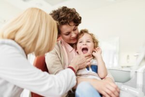 When should my child first see a dentist?